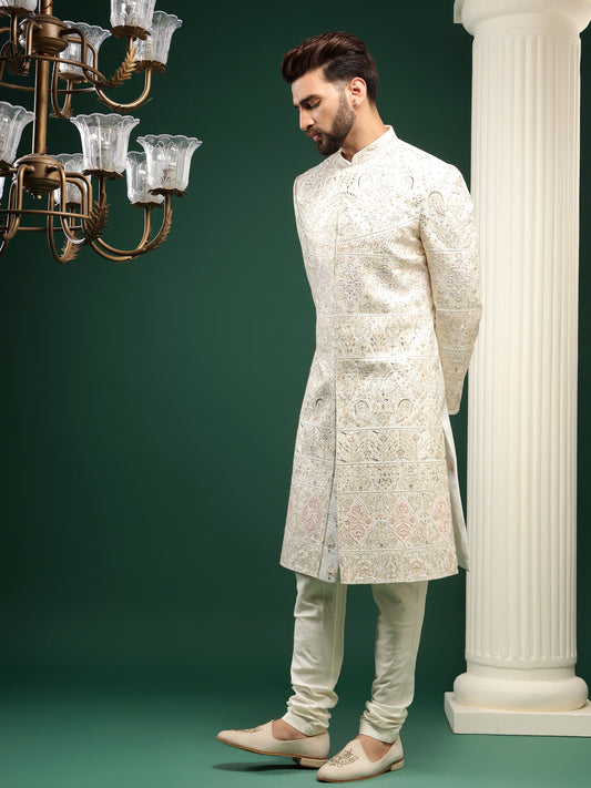 Pristine cream sherwani with ethnic motifs