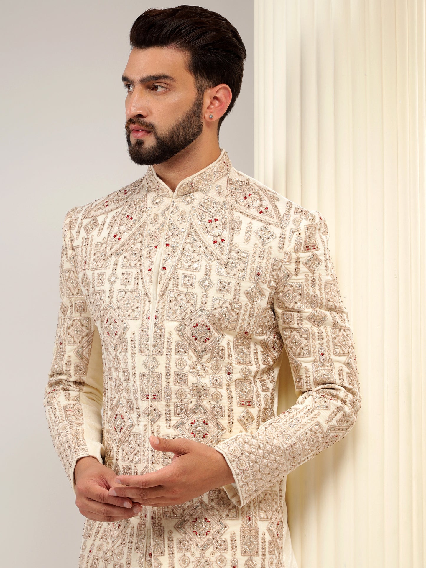 VELVET CREAM SHERWANI WITH TRADITIONAL MOTIFS