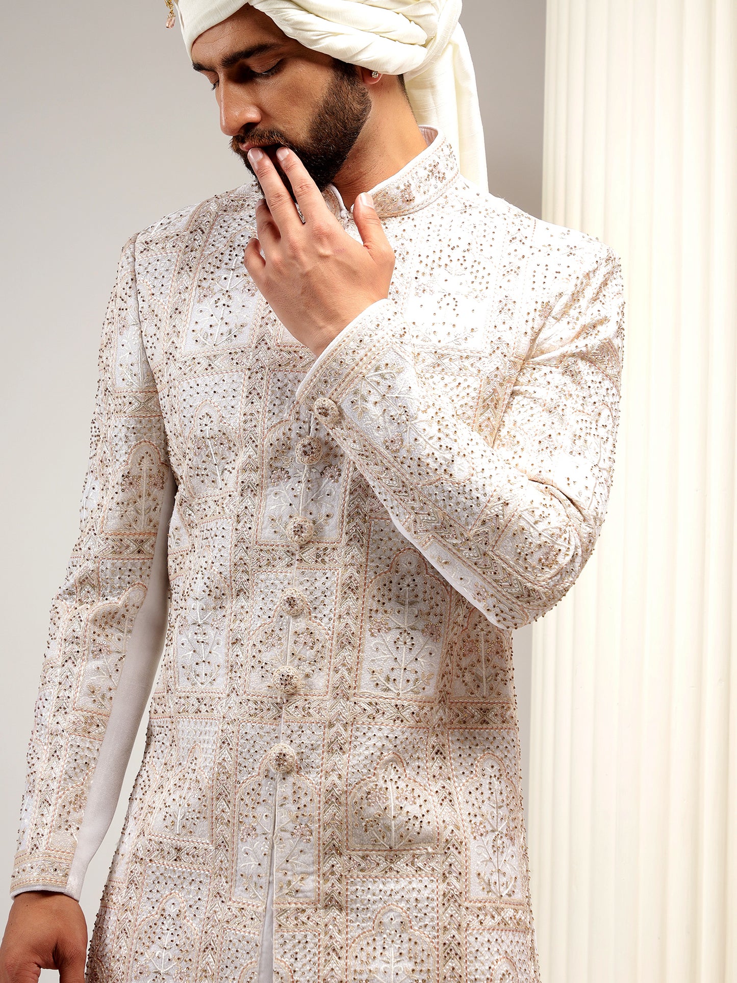 ENCHANTING CREAM COLOR SELF EMBROIDERED SHERWANI SET