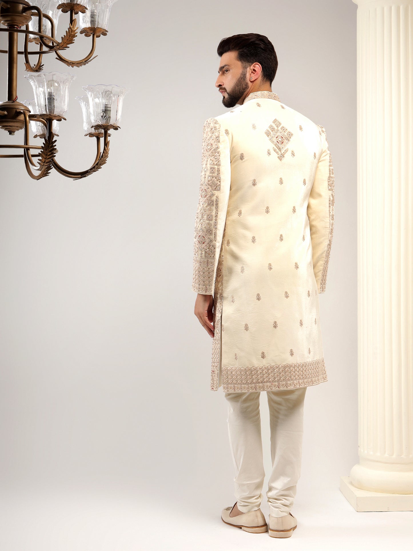 VELVET CREAM SHERWANI WITH TRADITIONAL MOTIFS