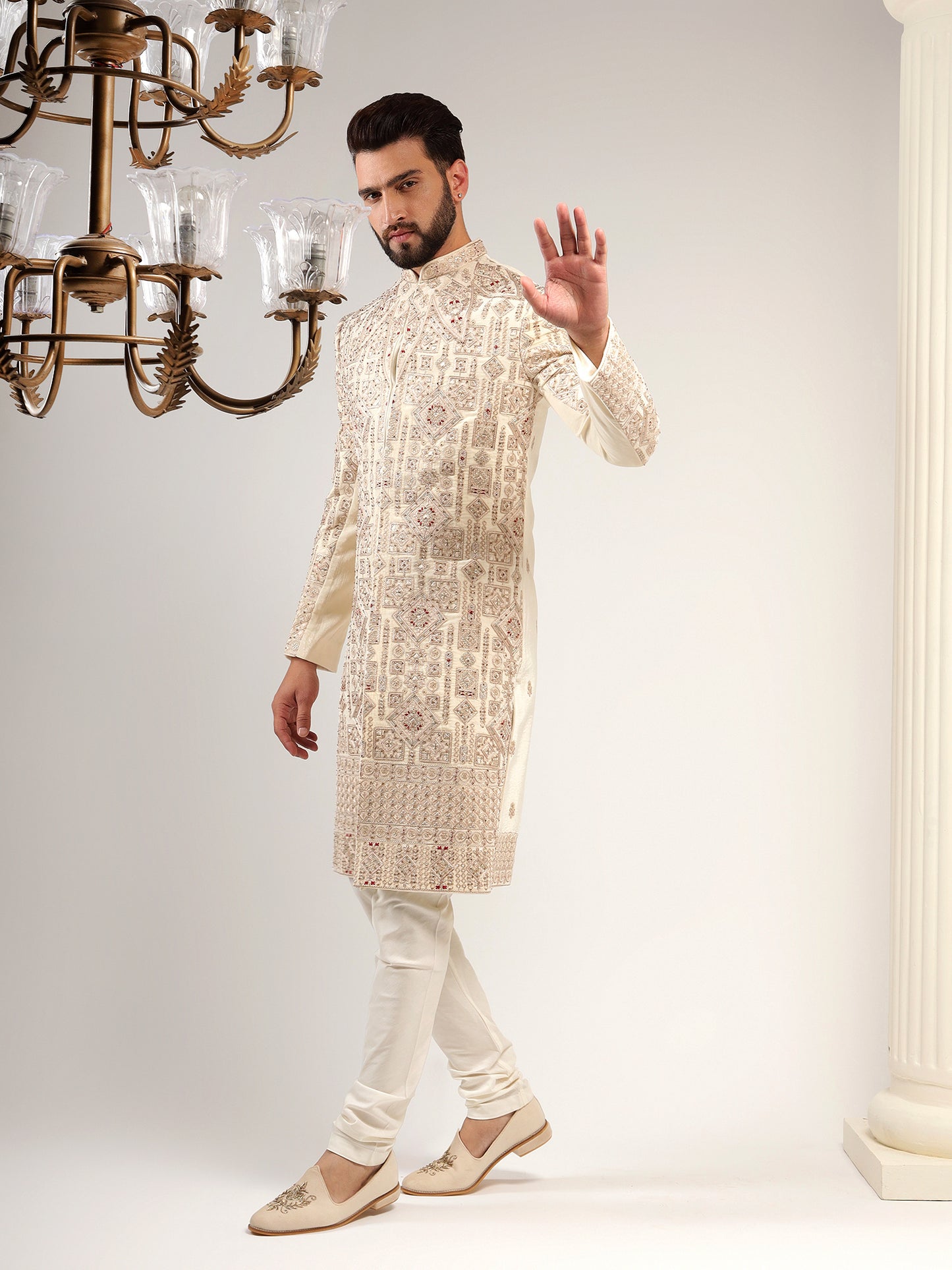 VELVET CREAM SHERWANI WITH TRADITIONAL MOTIFS