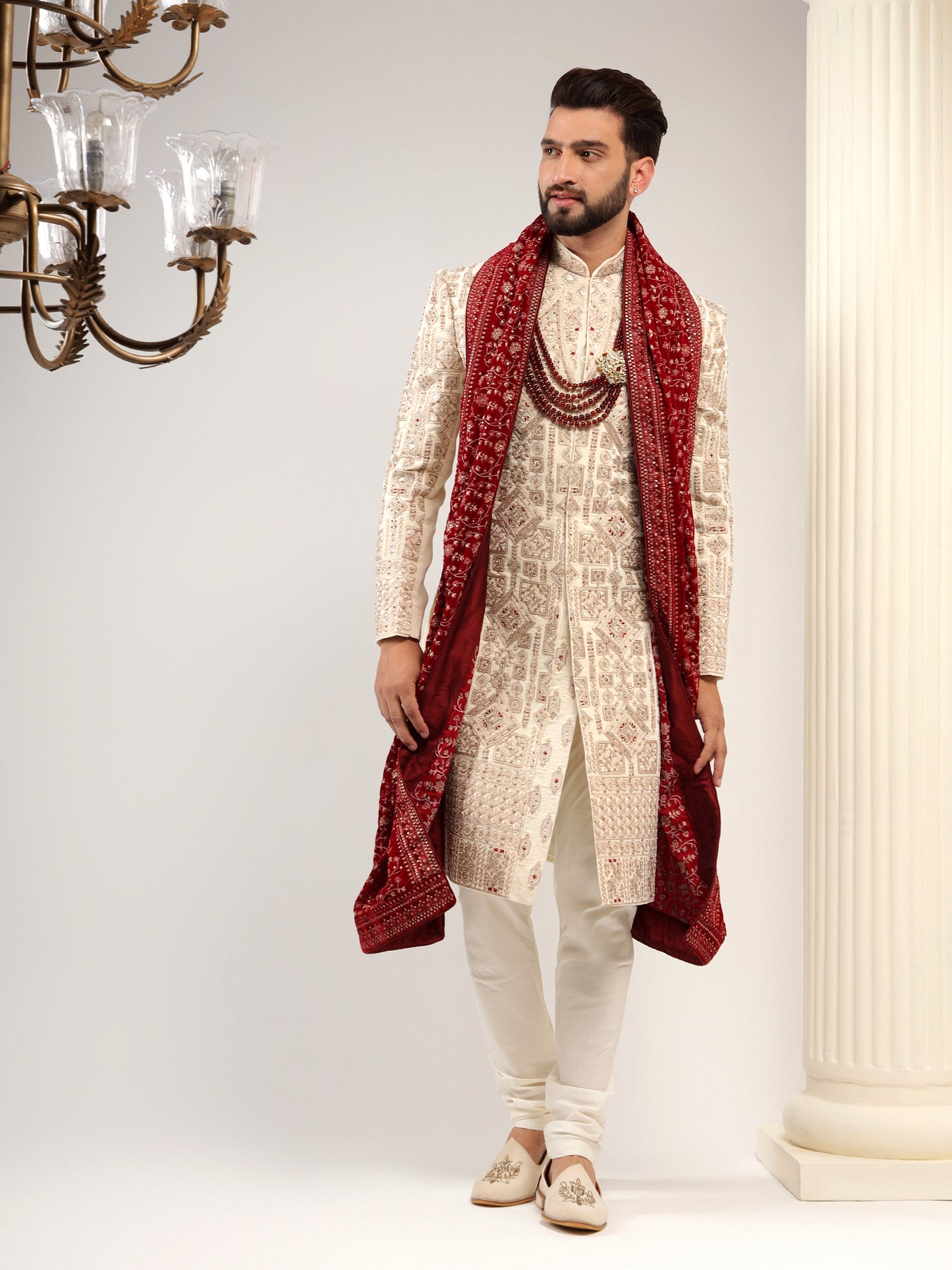 VELVET CREAM SHERWANI WITH TRADITIONAL MOTIFS