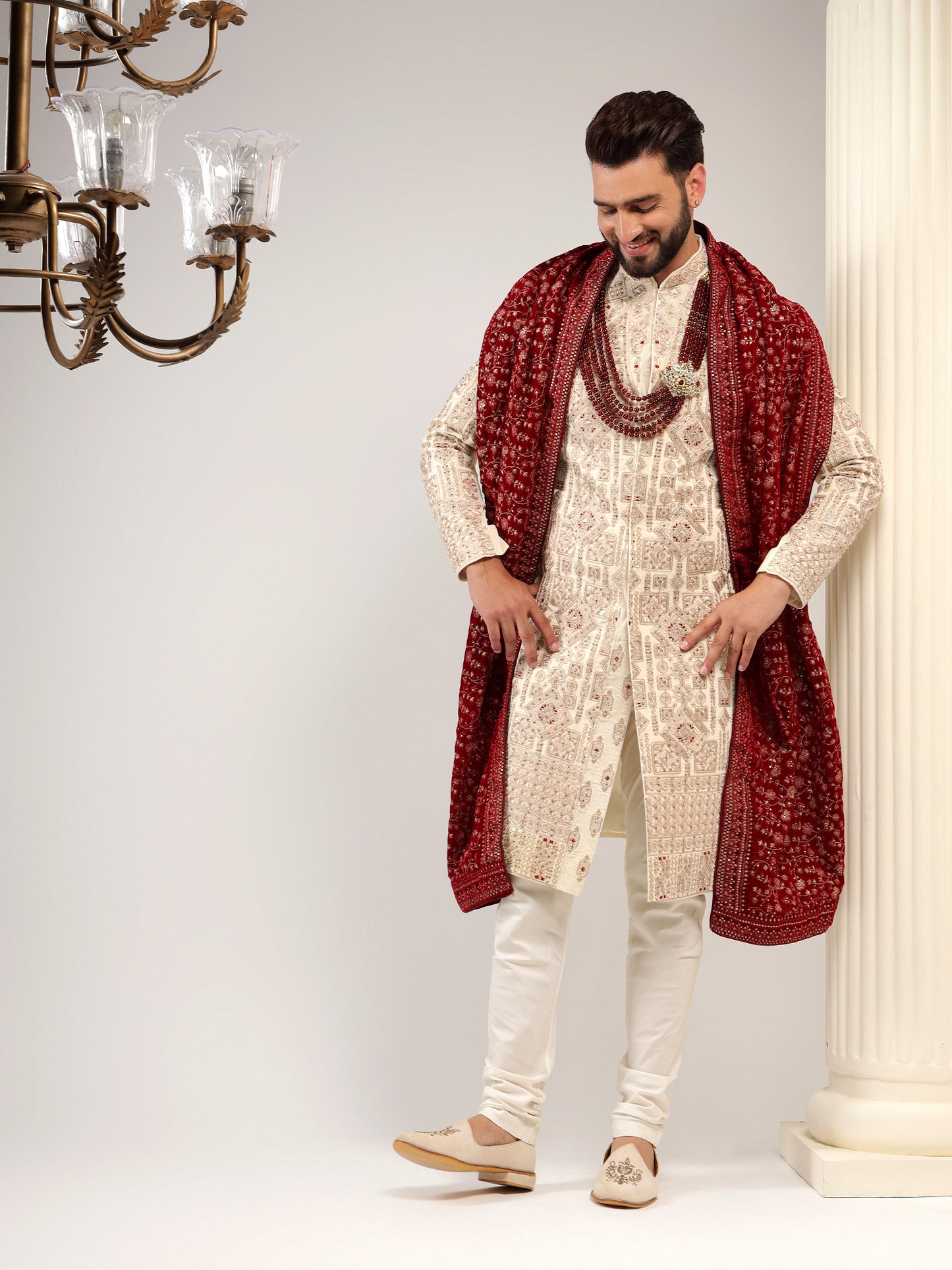 VELVET CREAM SHERWANI WITH TRADITIONAL MOTIFS