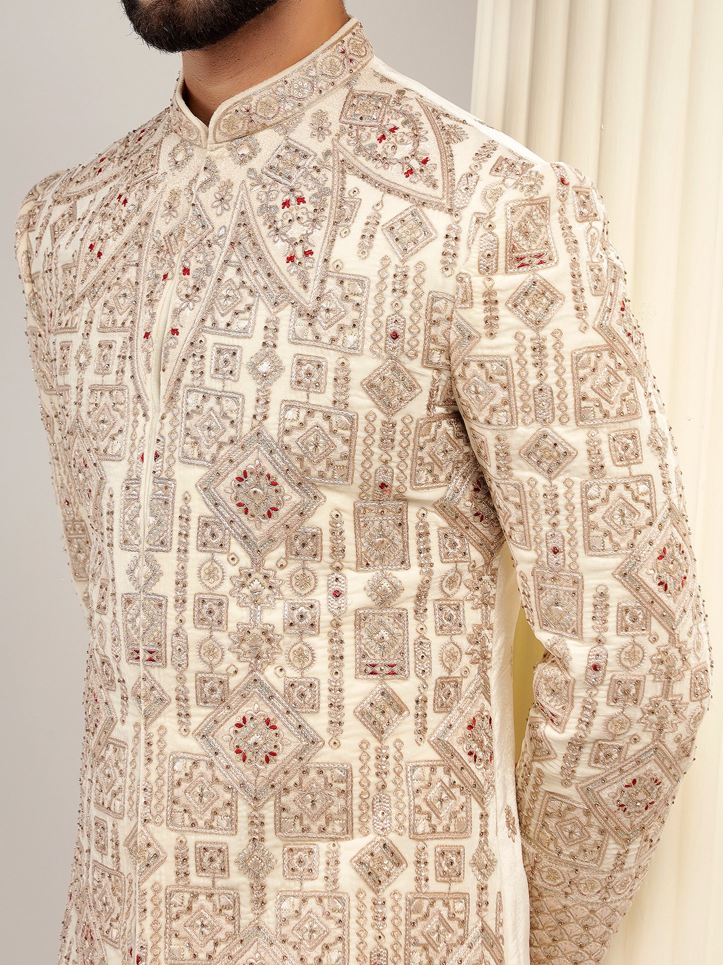 VELVET CREAM SHERWANI WITH TRADITIONAL MOTIFS